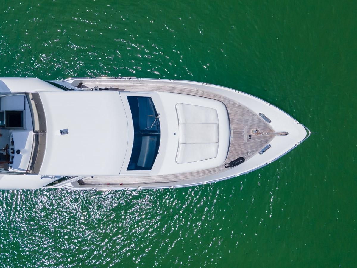 a white boat on water aboard OLD SPORT II Yacht for Sale