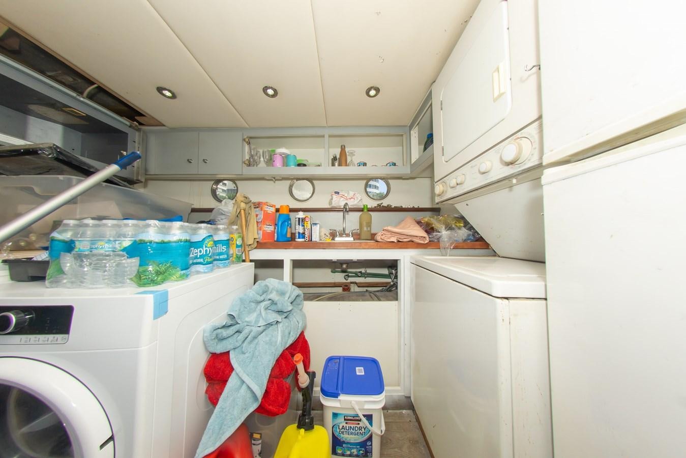 a laundry room with a washer and dryer aboard OLD SPORT II Yacht for Sale