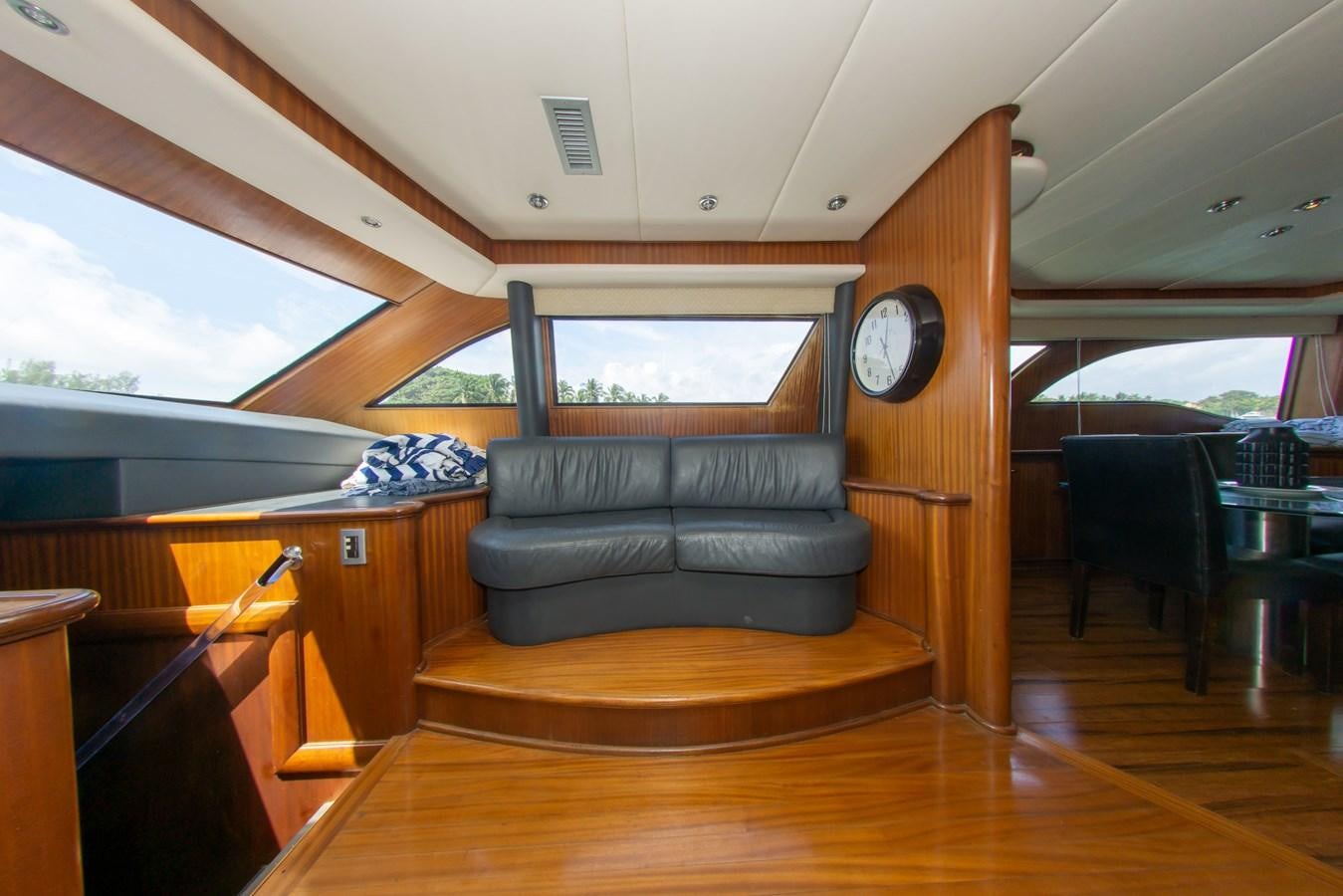 a living room with a couch and a wood floor aboard OLD SPORT II Yacht for Sale