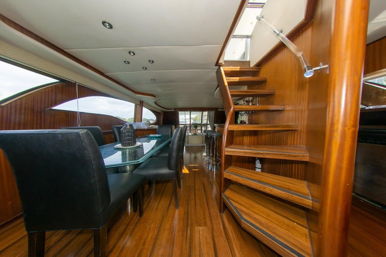 a room with a table and chairs aboard OLD SPORT II Yacht for Sale