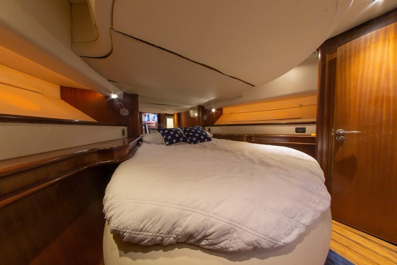a room with a bed and a door aboard OLD SPORT II Yacht for Sale