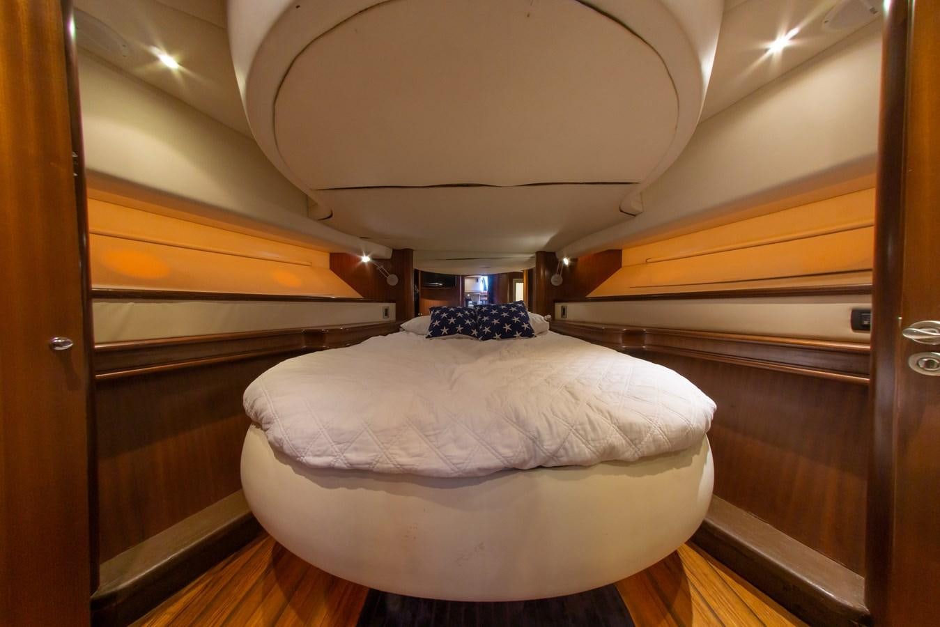 a room with a bed and a mirror aboard OLD SPORT II Yacht for Sale