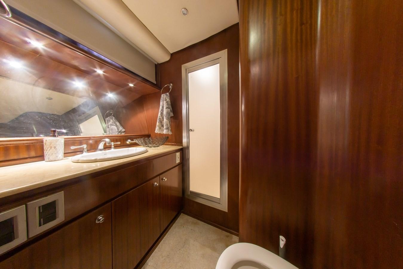 a bathroom with a large mirror aboard OLD SPORT II Yacht for Sale