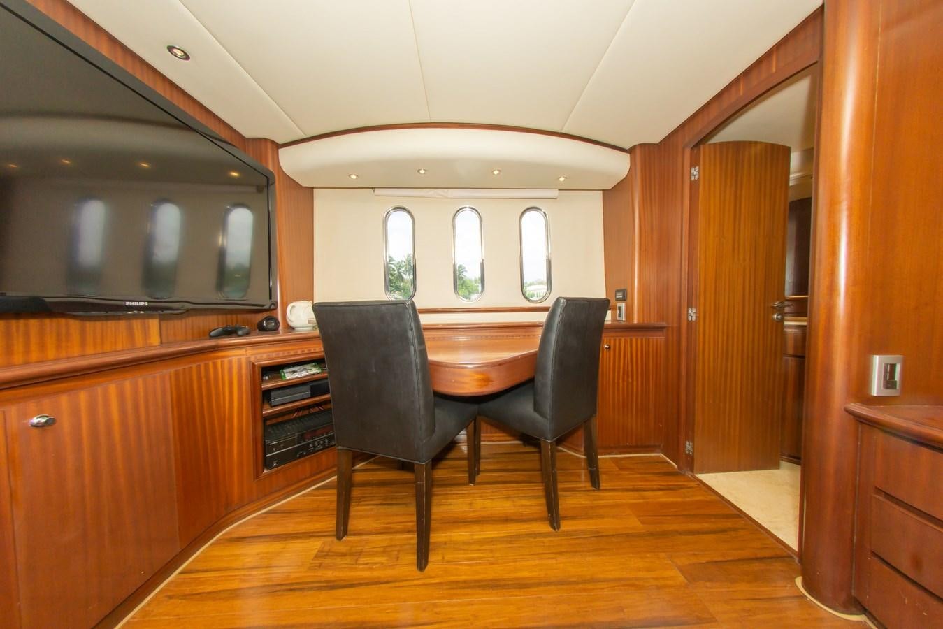 a kitchen with a dining table aboard OLD SPORT II Yacht for Sale