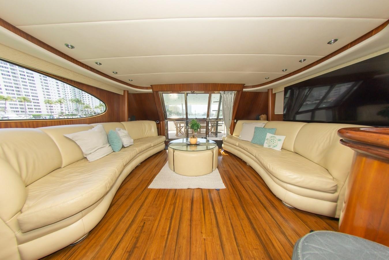 a living room with a couch and a table aboard OLD SPORT II Yacht for Sale