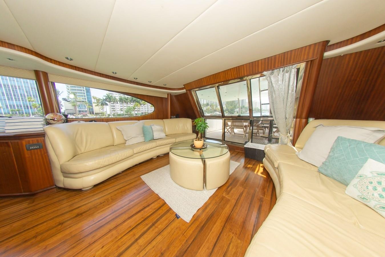 a living room with a couch and a table aboard OLD SPORT II Yacht for Sale