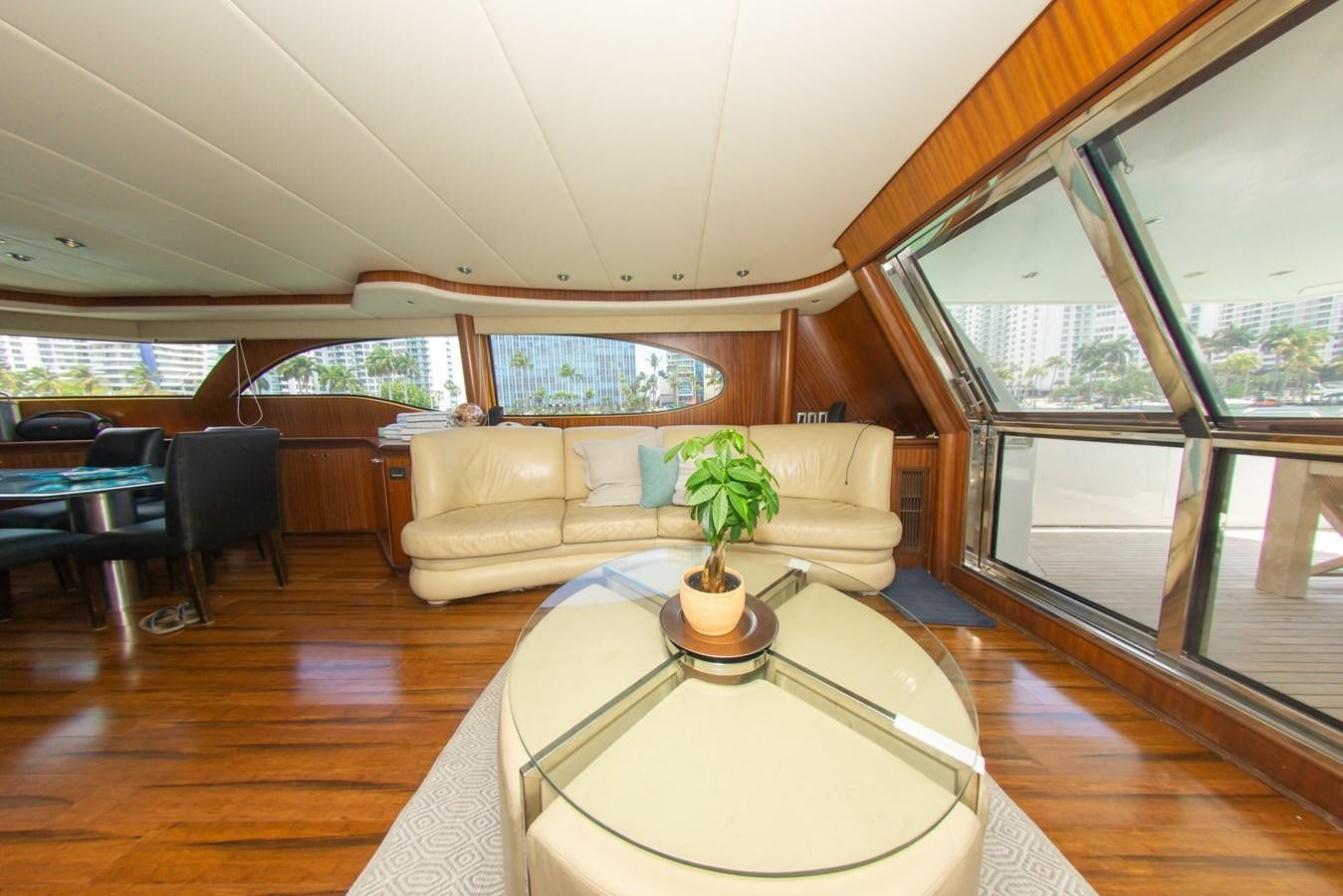 a living room with a table and chairs aboard OLD SPORT II Yacht for Sale