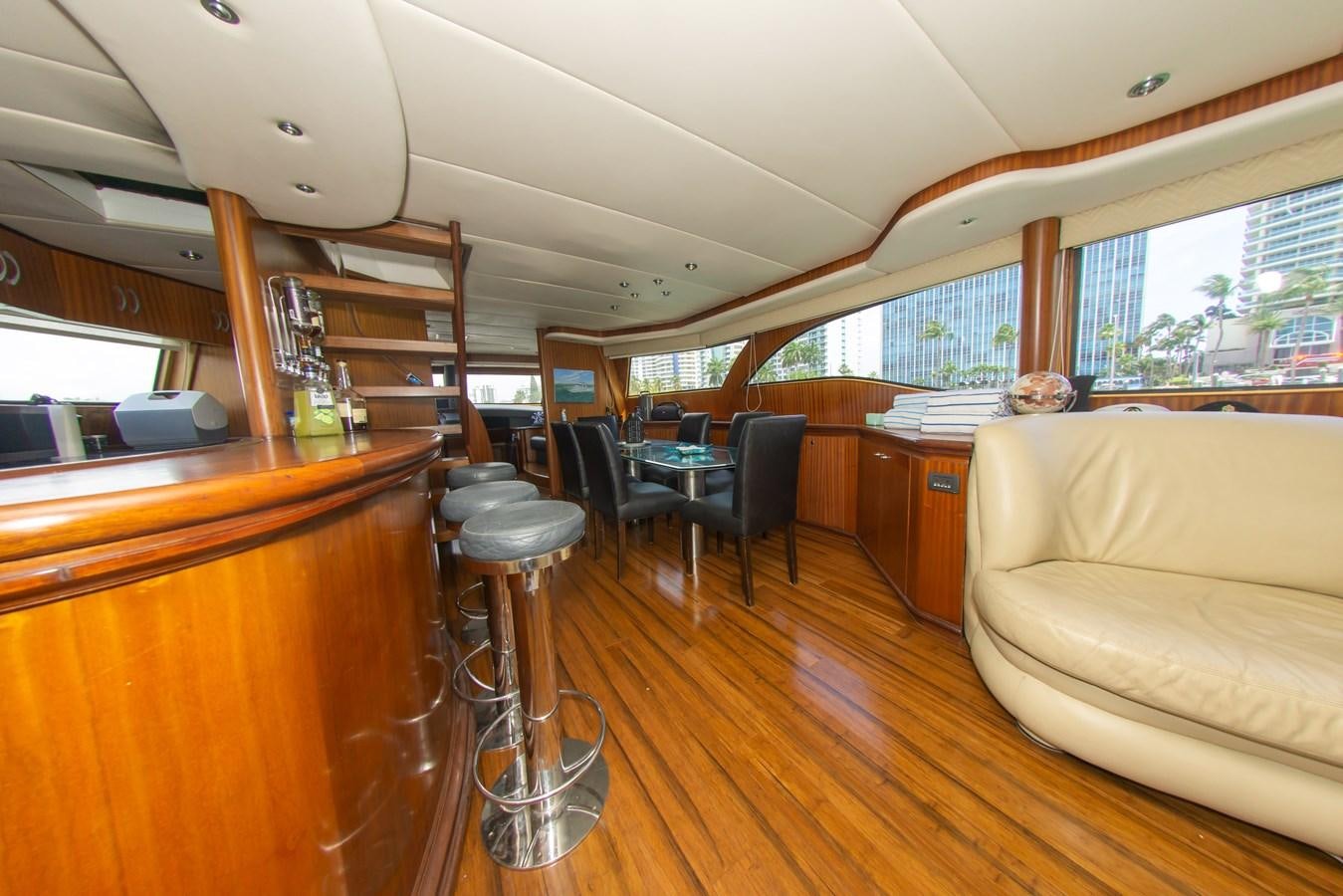 a living room with a couch and a table aboard OLD SPORT II Yacht for Sale