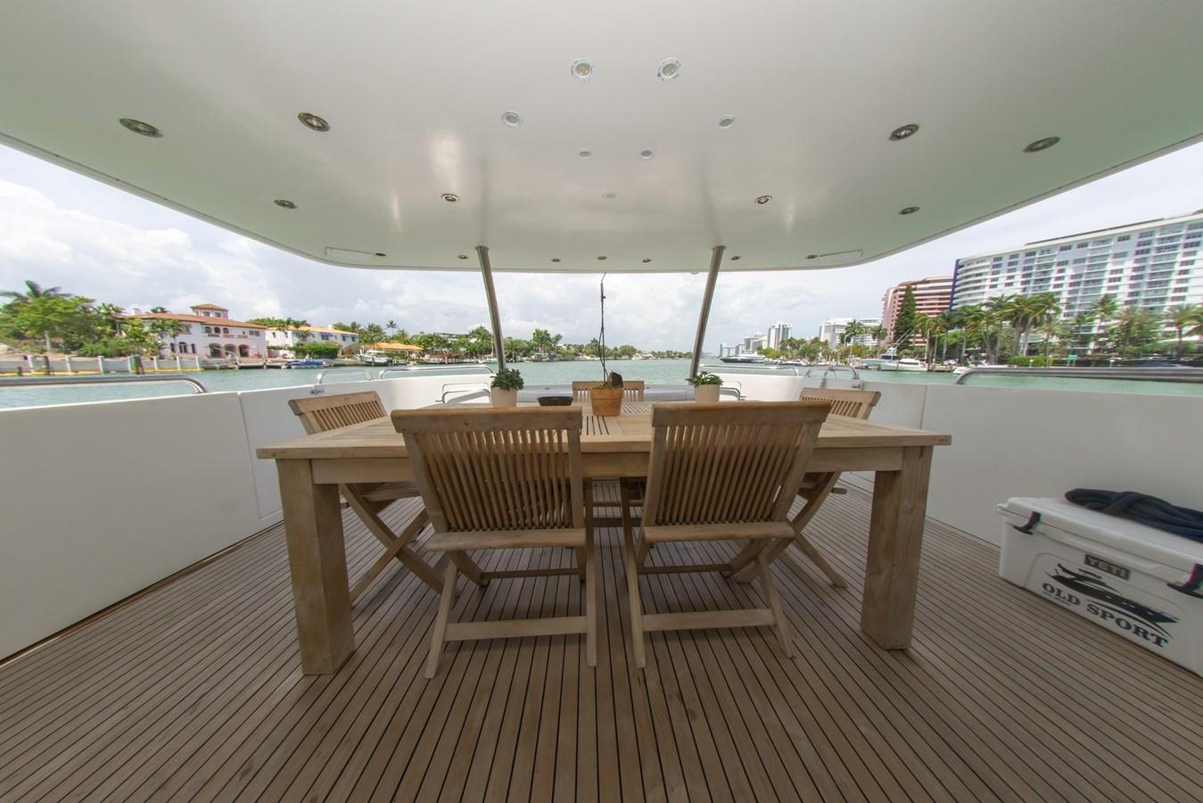 a table and chairs on a deck aboard OLD SPORT II Yacht for Sale