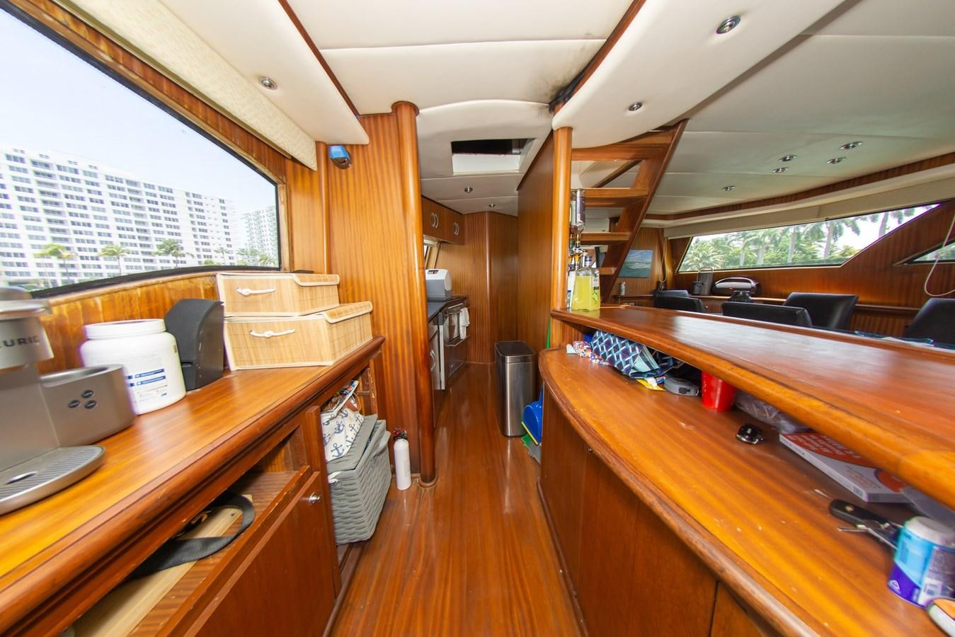 a room with wooden furniture aboard OLD SPORT II Yacht for Sale