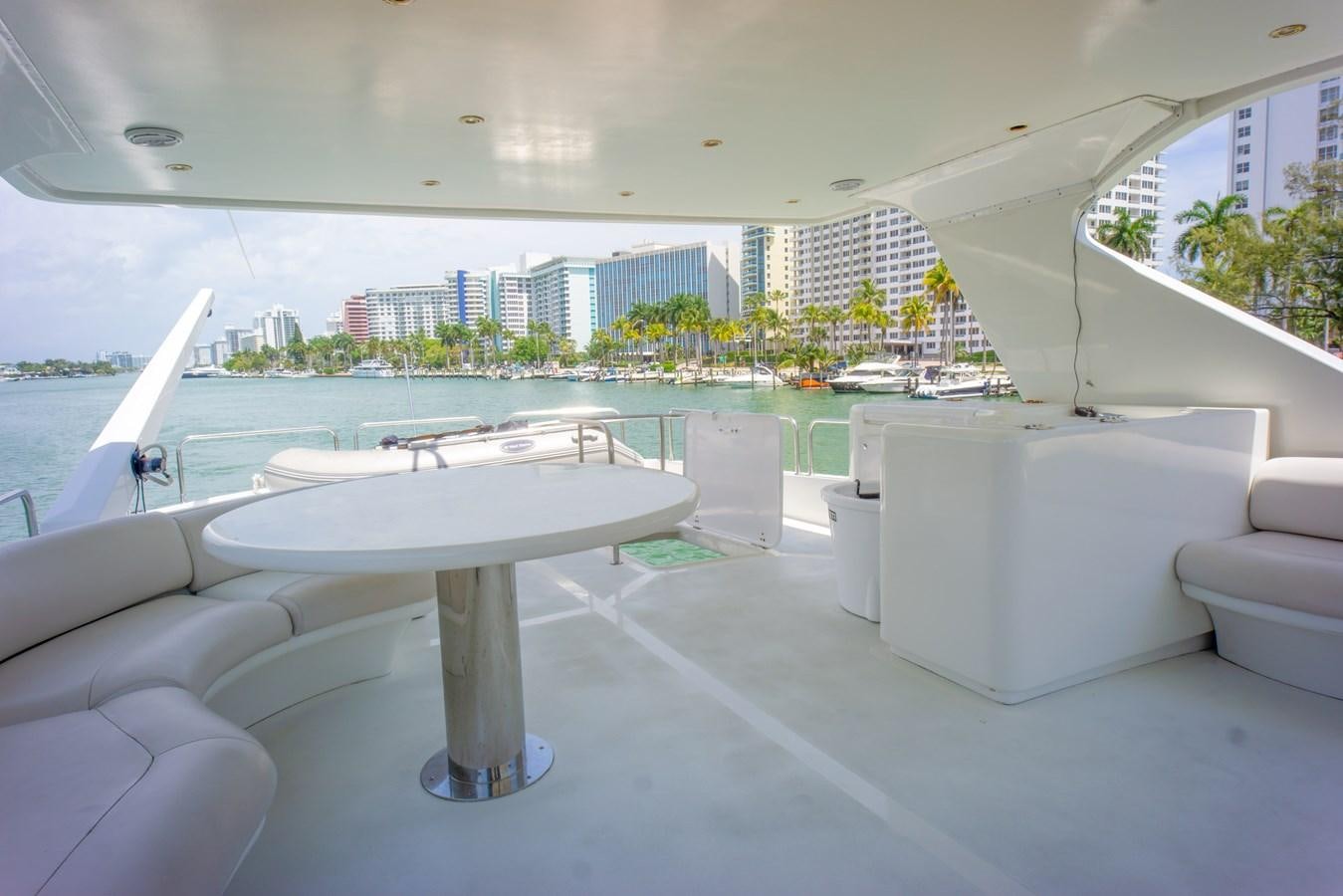 a room with a table and chairs aboard OLD SPORT II Yacht for Sale