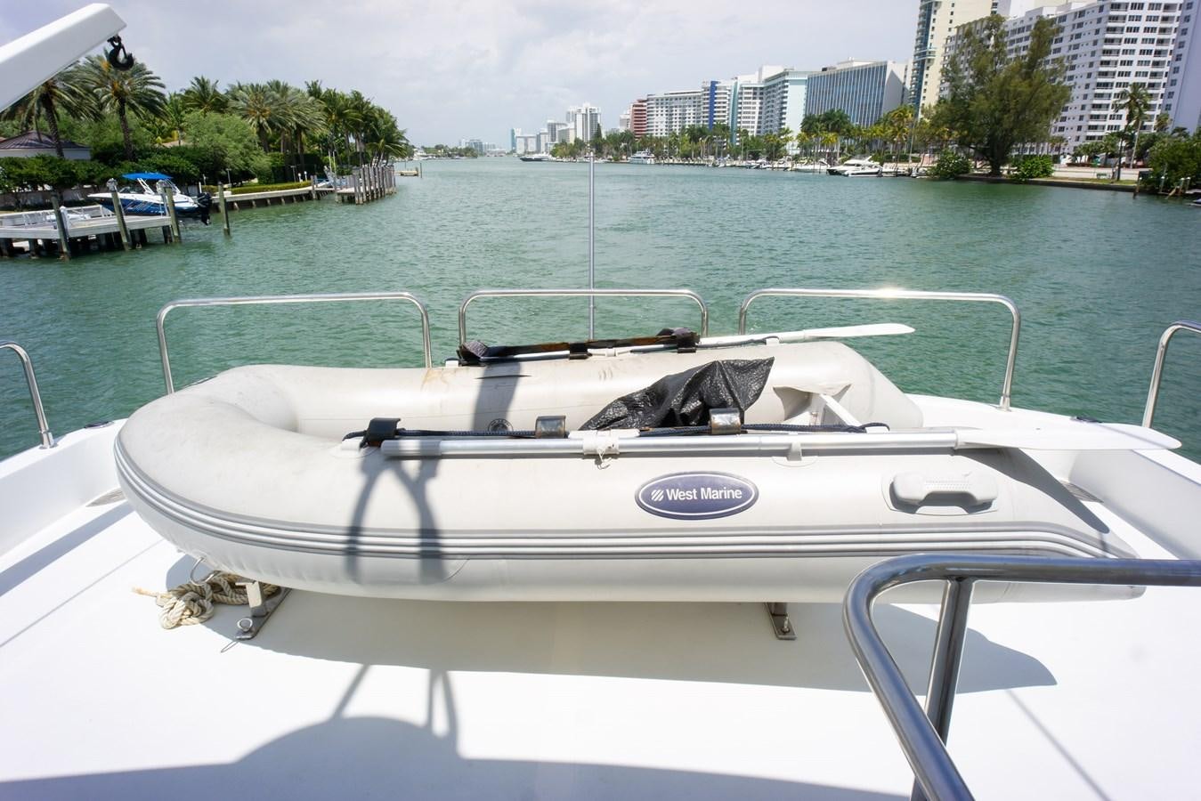 a white boat on a body of water aboard OLD SPORT II Yacht for Sale