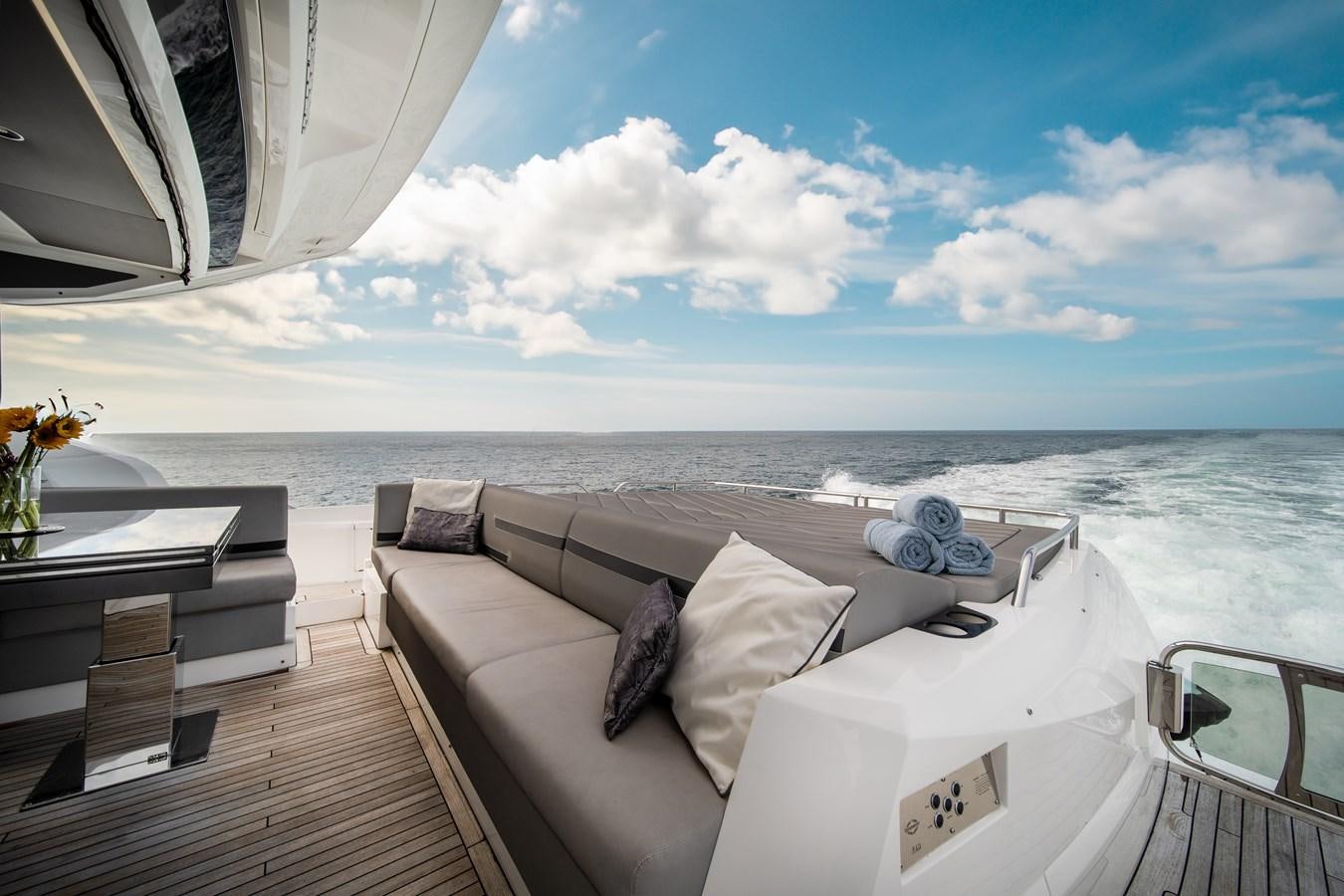 a room with a bed and a table and chairs aboard BELLOW DECK Yacht for Sale