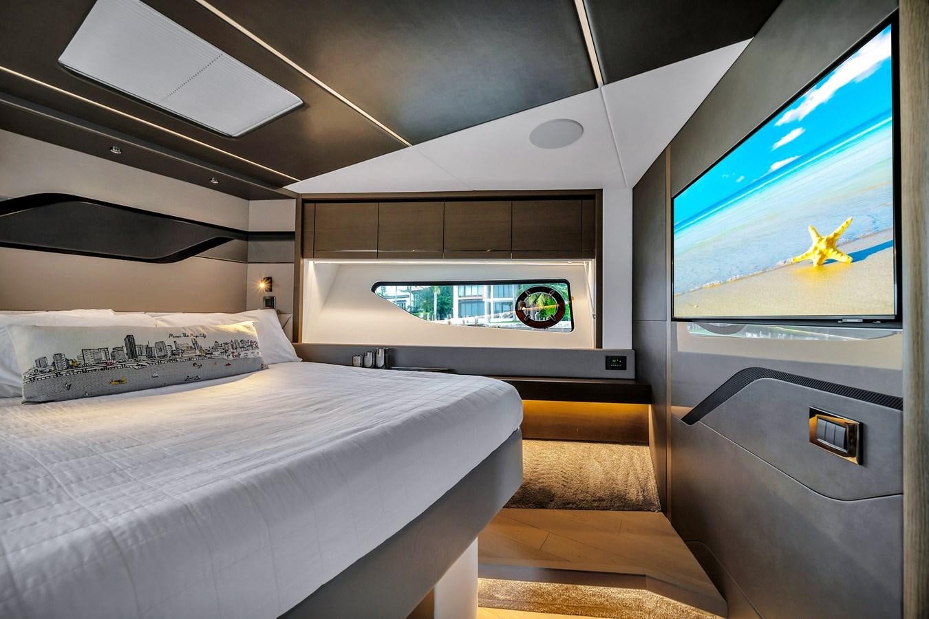 a room with a bed and a tv aboard BELLOW DECK Yacht for Sale