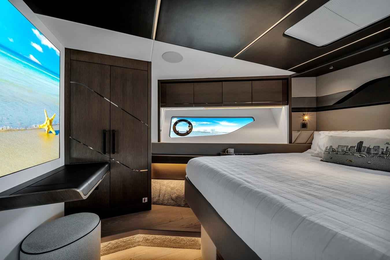 a room with a bed and a tv aboard BELLOW DECK Yacht for Sale