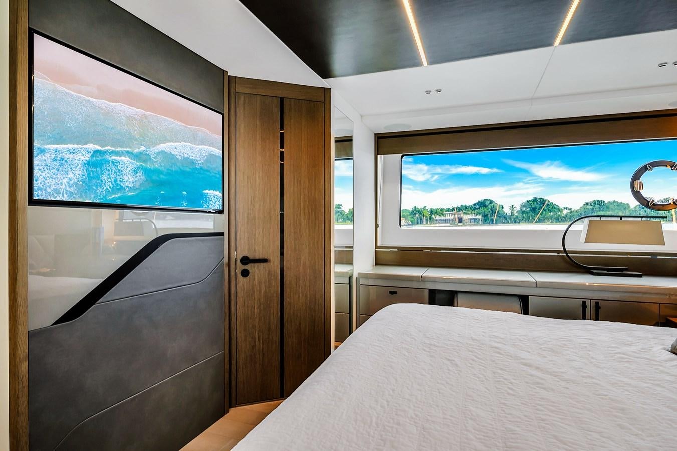 a room with a bed and a window aboard BELLOW DECK Yacht for Sale
