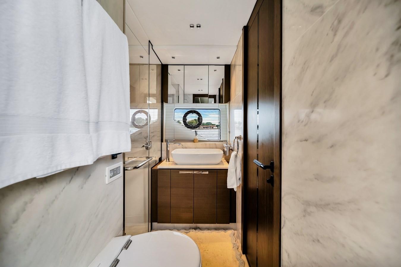 a bathroom with a sink and toilet aboard BELLOW DECK Yacht for Sale