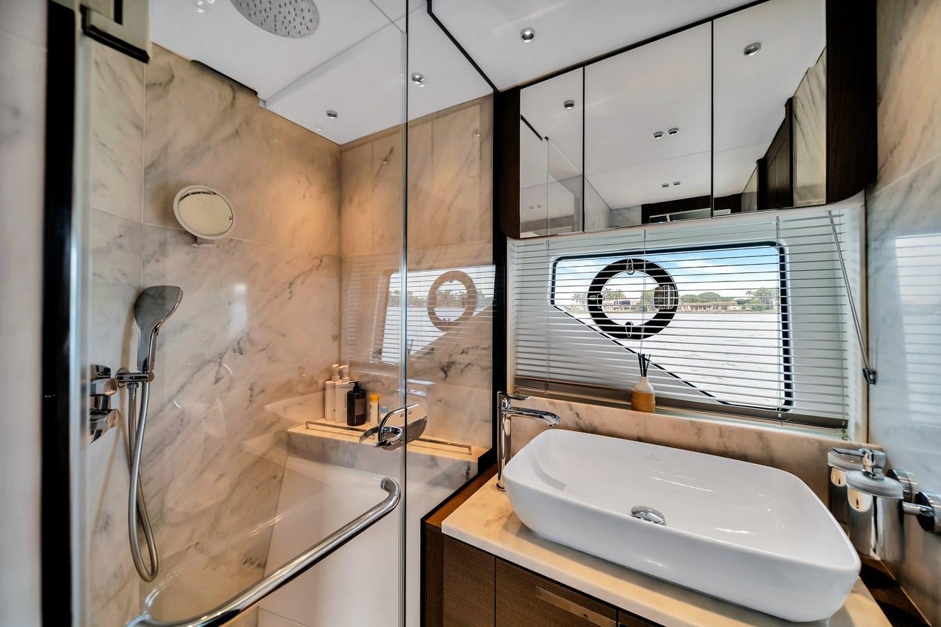 a bathroom with a sink and a shower aboard BELLOW DECK Yacht for Sale