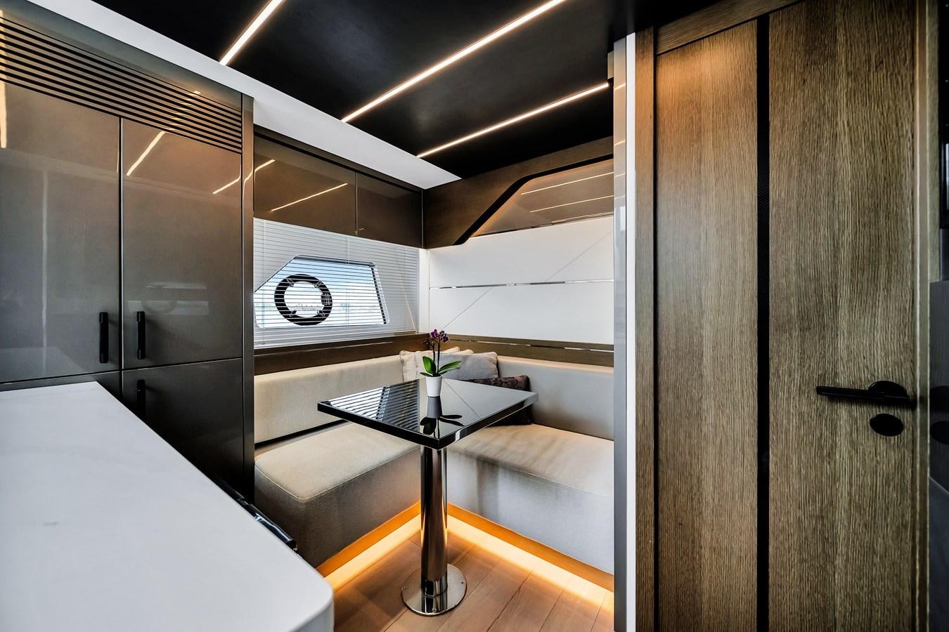 a room with a table and cabinets aboard BELLOW DECK Yacht for Sale