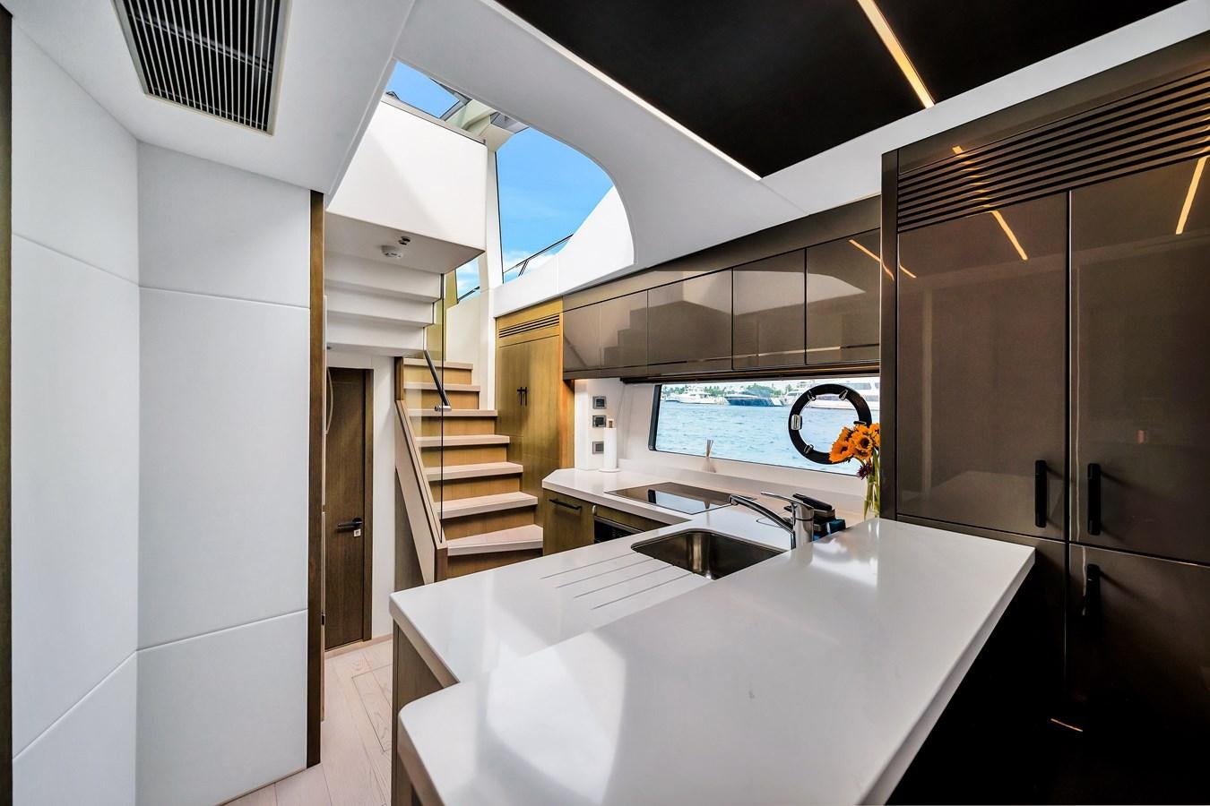 a kitchen with a large island aboard BELLOW DECK Yacht for Sale