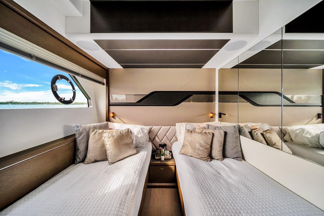 a room with a bed and a window aboard BELLOW DECK Yacht for Sale