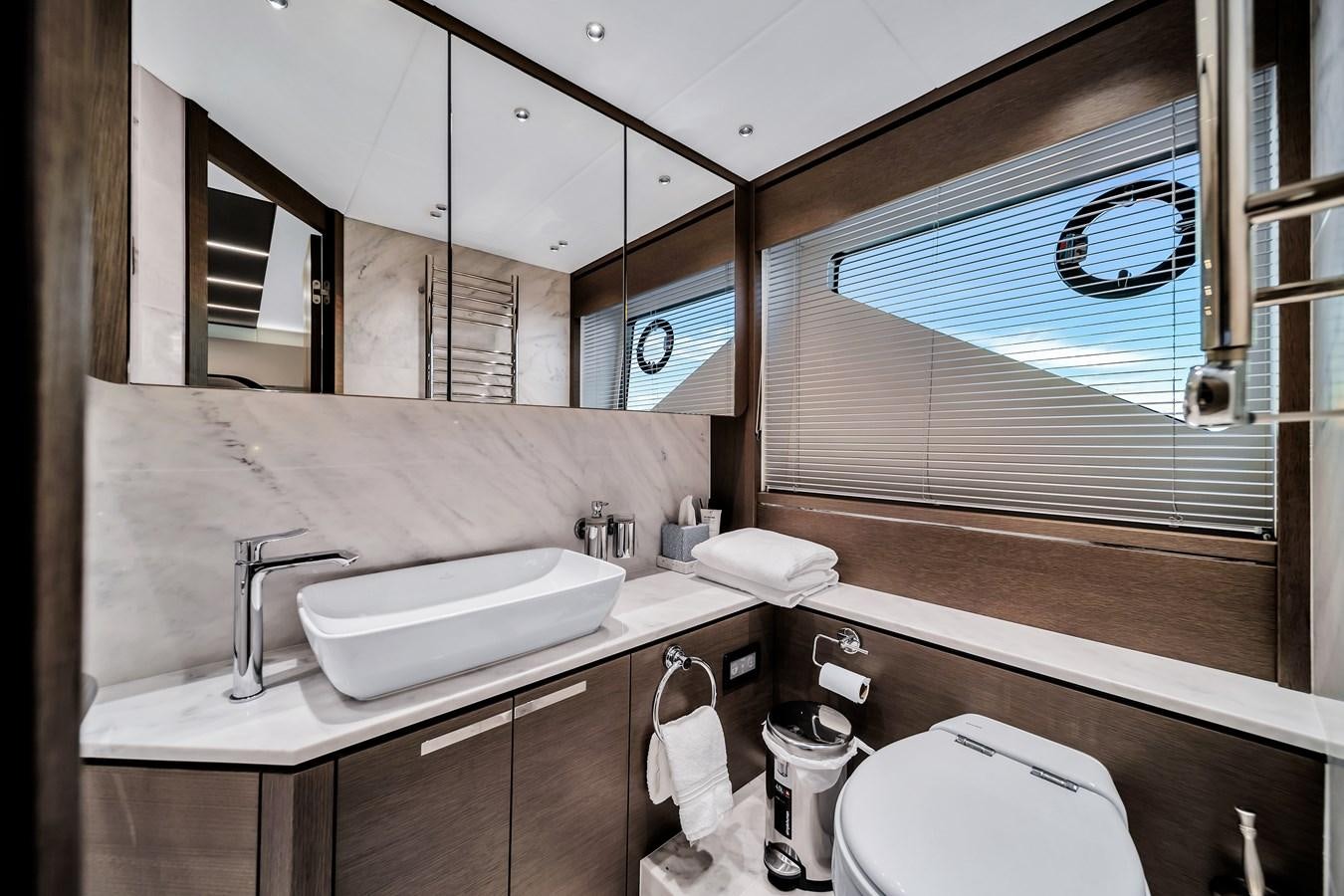 a bathroom with a sink and a toilet aboard BELLOW DECK Yacht for Sale