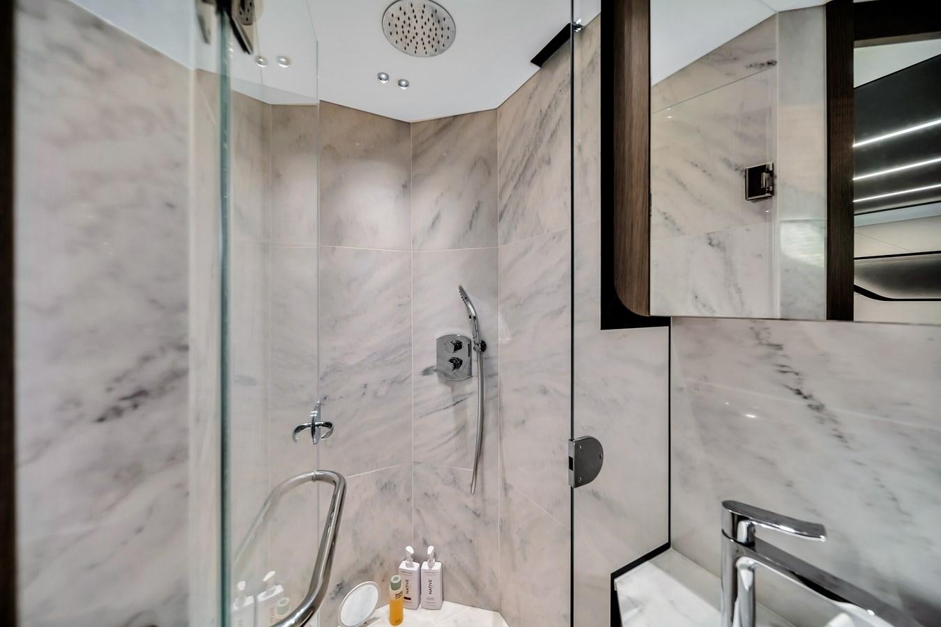 a bathroom with a glass shower aboard BELLOW DECK Yacht for Sale