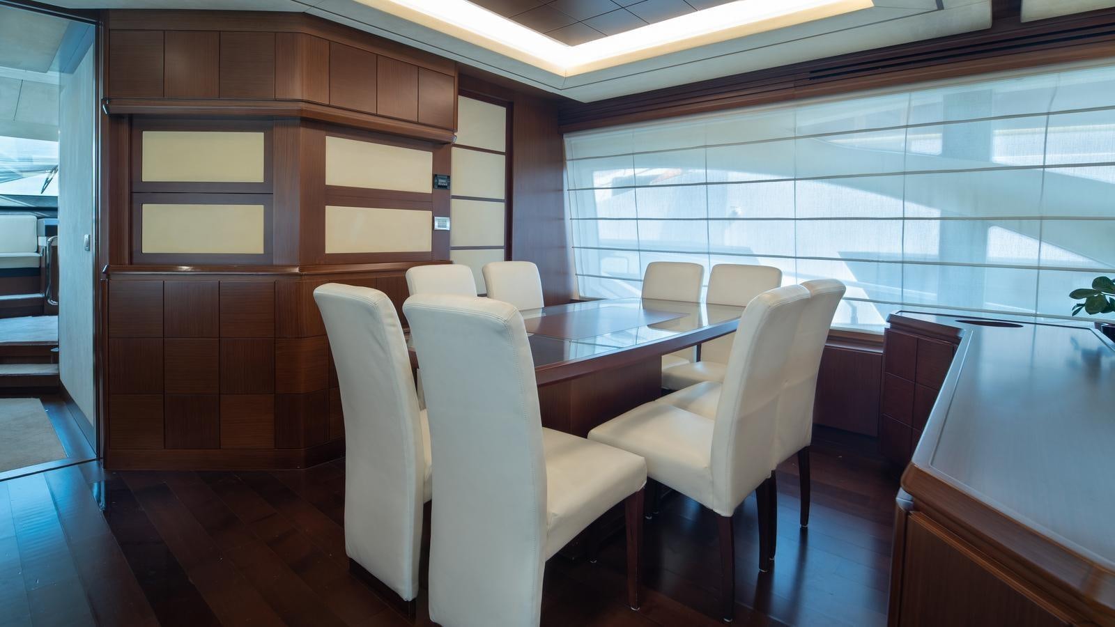 a room with chairs and a table aboard KOUKLES Yacht for Sale