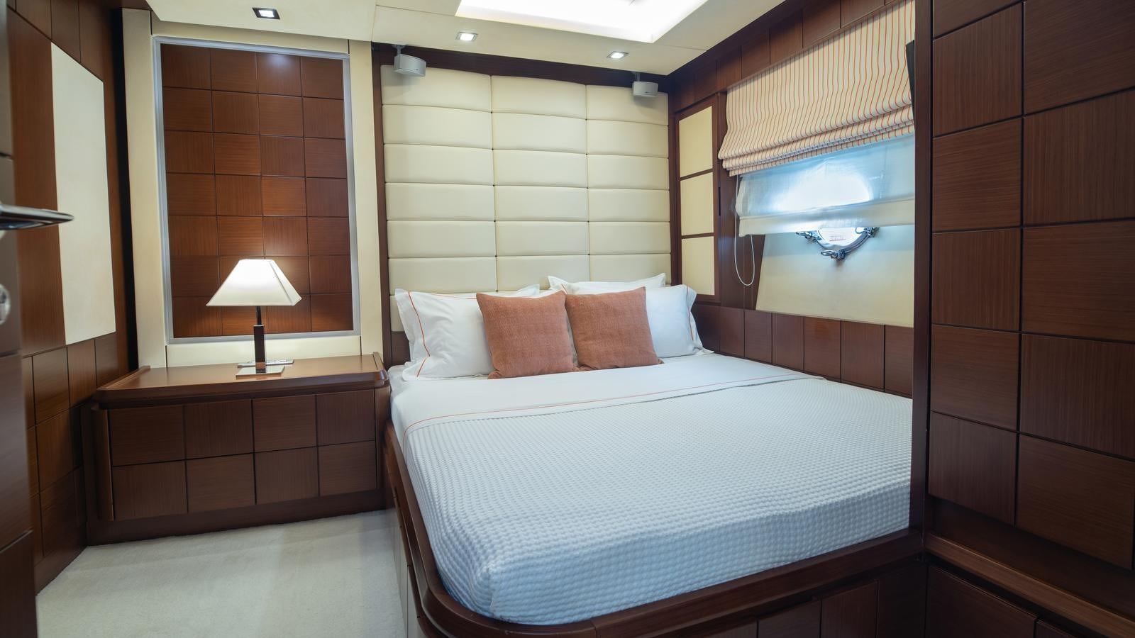 a bed with a white sheet aboard KOUKLES Yacht for Sale