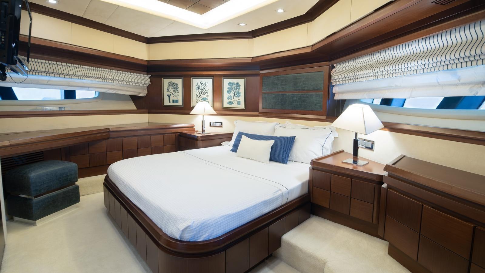 a room with a bed and a desk aboard KOUKLES Yacht for Sale