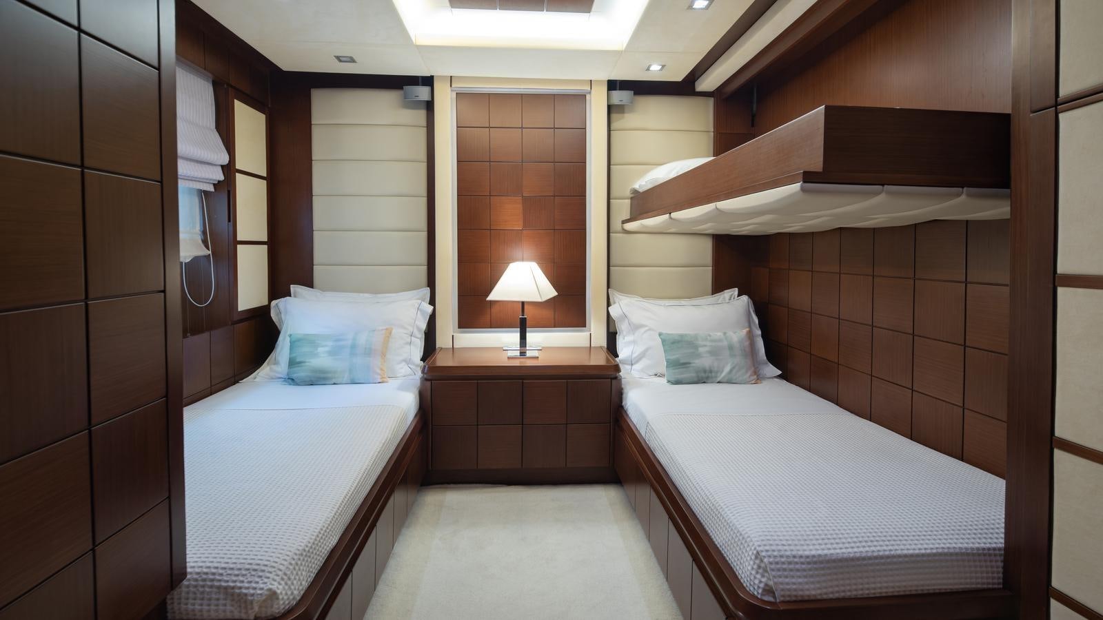 a couple of beds in a hotel room aboard KOUKLES Yacht for Sale