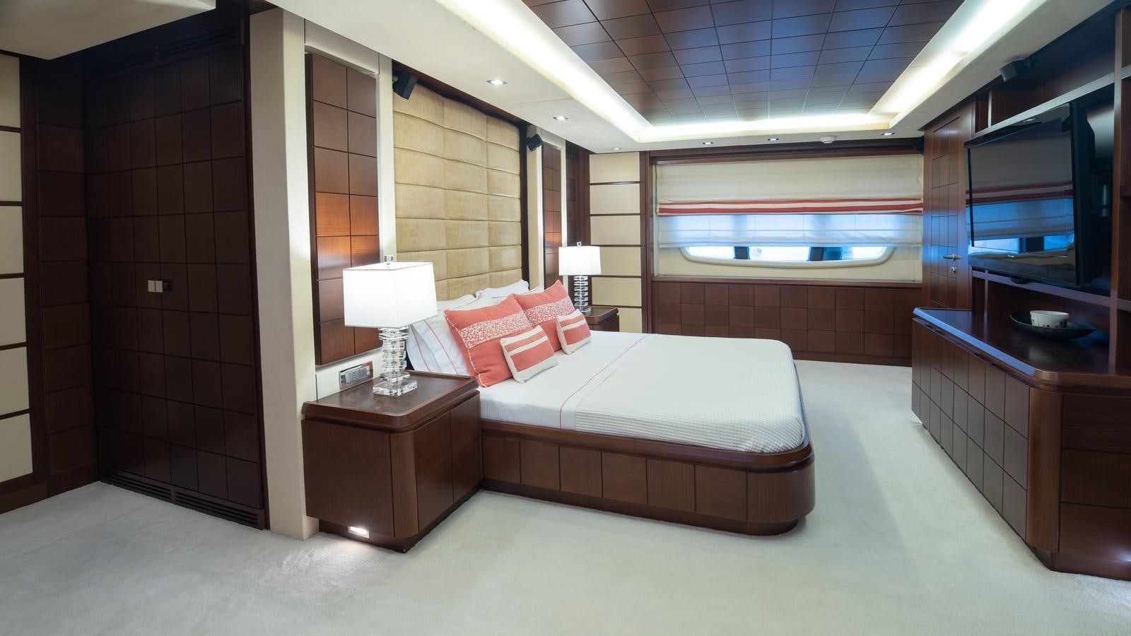 a room with a bed and a desk aboard KOUKLES Yacht for Sale