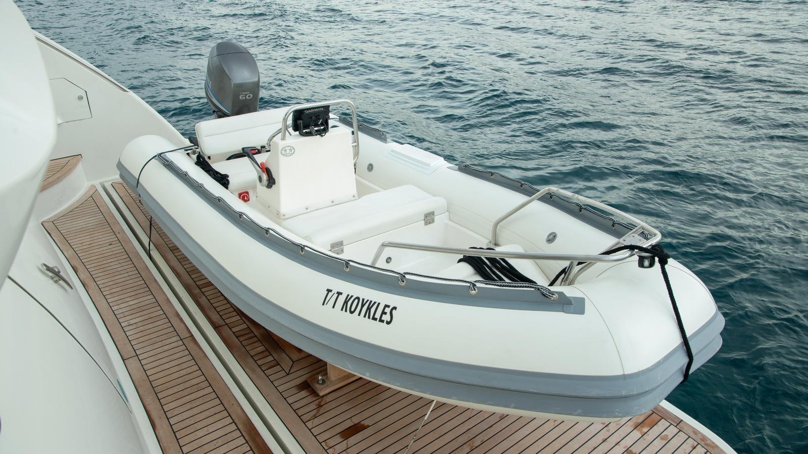 a white boat on the water aboard KOUKLES Yacht for Sale