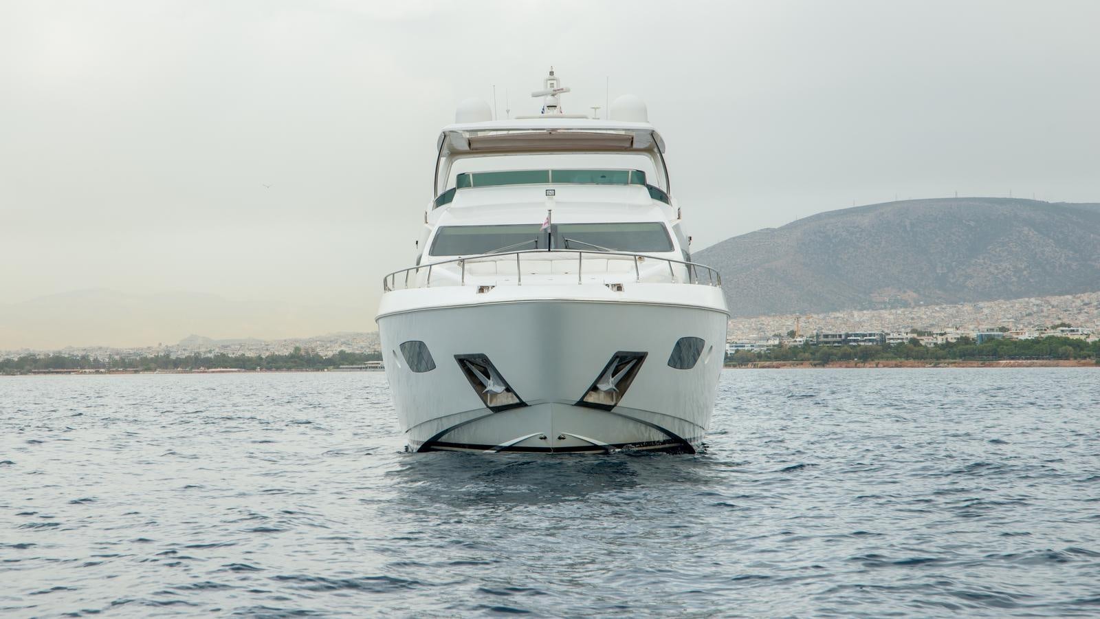 a white boat on the water aboard KOUKLES Yacht for Sale