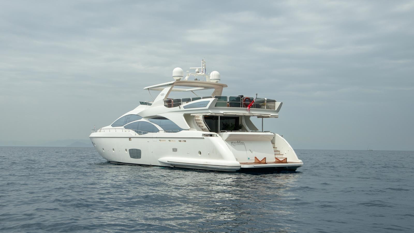 a white yacht in the water aboard KOUKLES Yacht for Sale