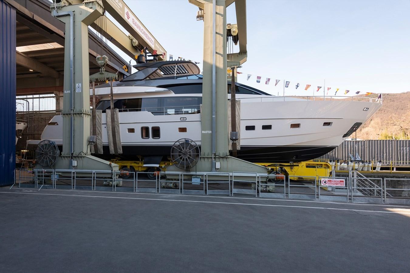 a large white ship docked aboard SL86 Yacht for Sale