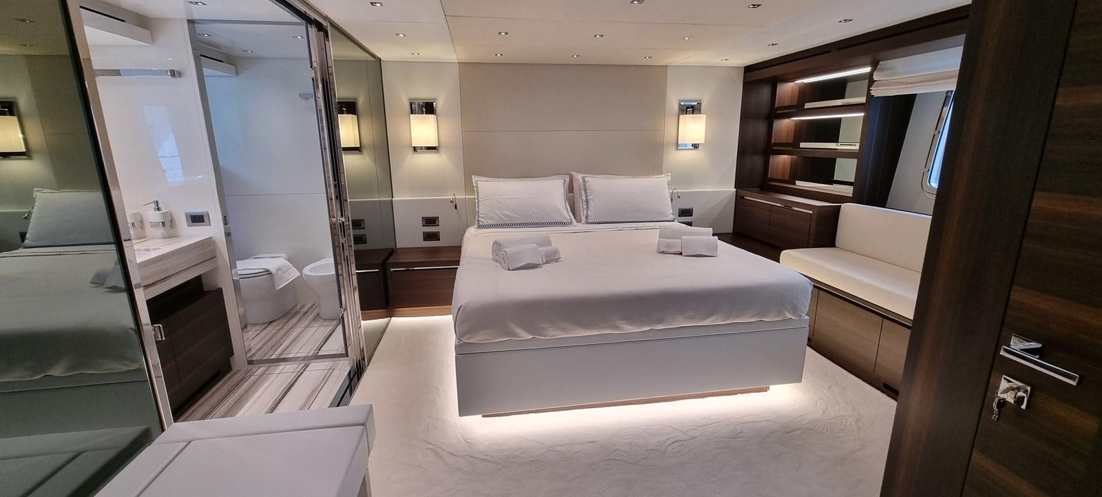 a room with a bed and a desk aboard SL86 Yacht for Sale