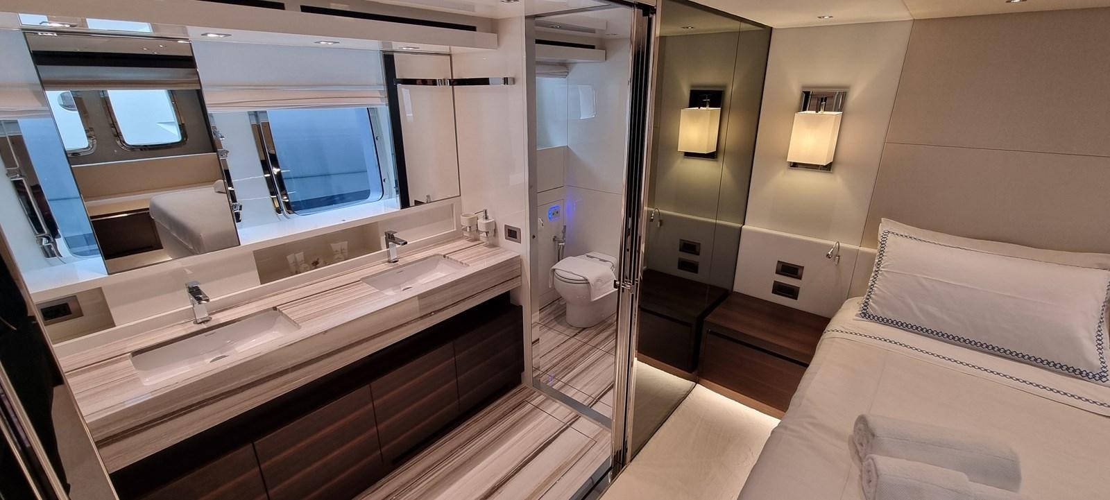 a bathroom with a large mirror aboard SL86 Yacht for Sale