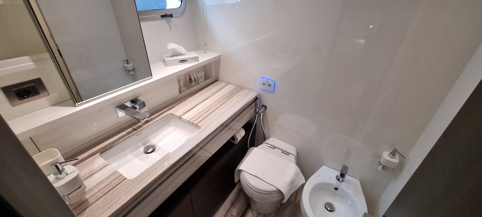 a bathroom with a sink and a toilet aboard SL86 Yacht for Sale