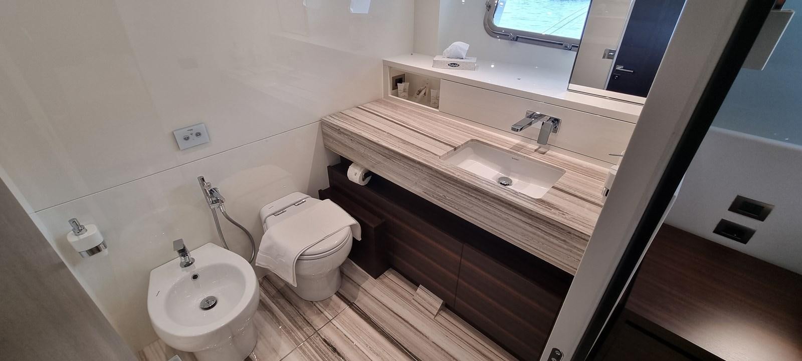 a bathroom with a sink and a toilet aboard SL86 Yacht for Sale