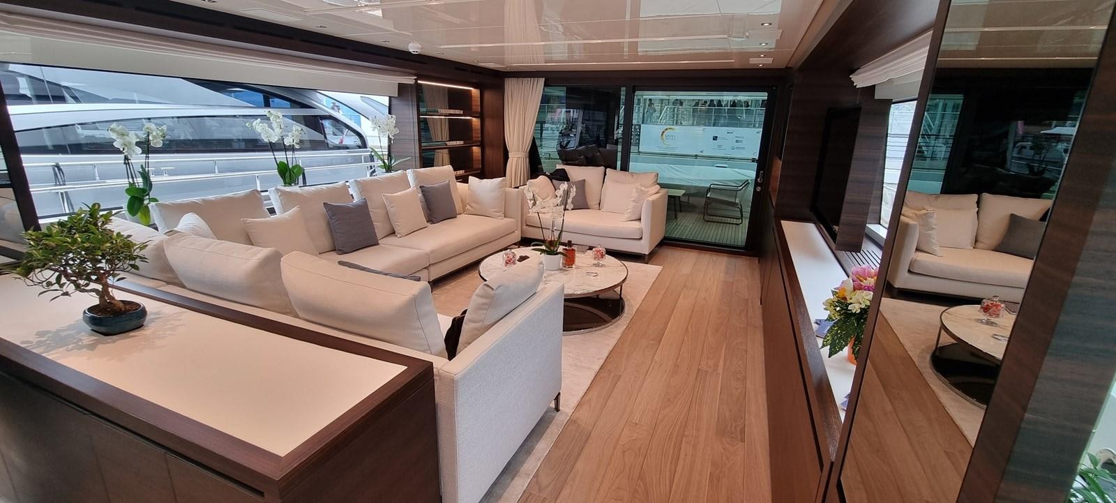 a living room with a large window aboard SL86 Yacht for Sale
