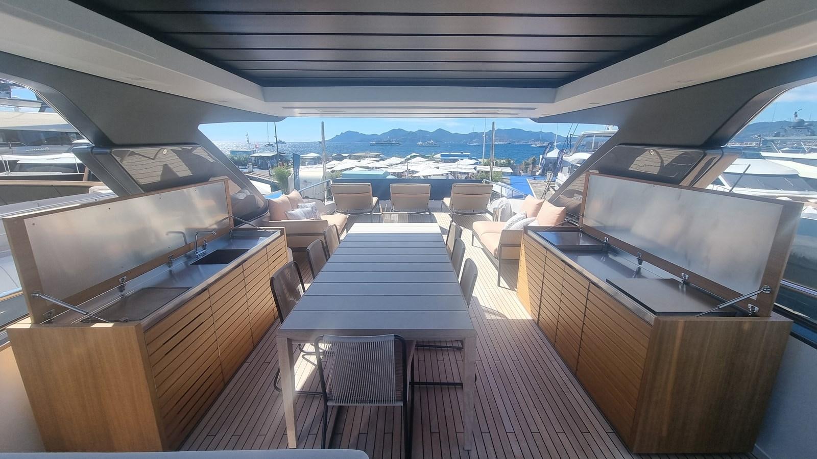 a boat with tables and chairs aboard SL86 Yacht for Sale
