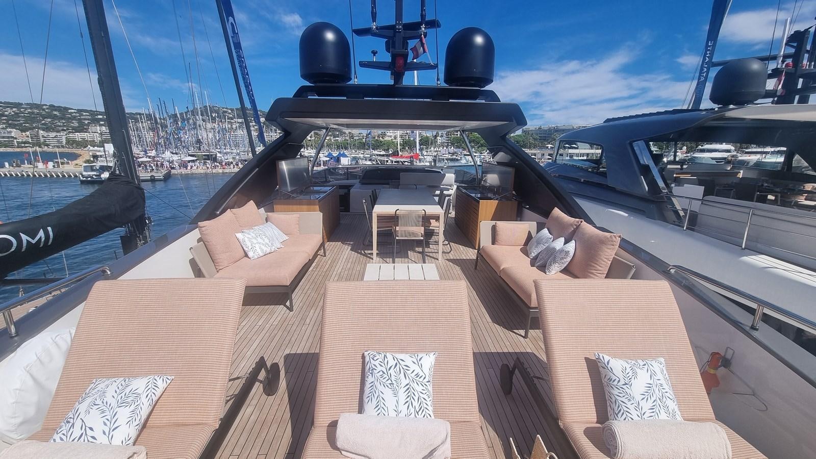 a deck with a view of the water and a boat aboard SL86 Yacht for Sale