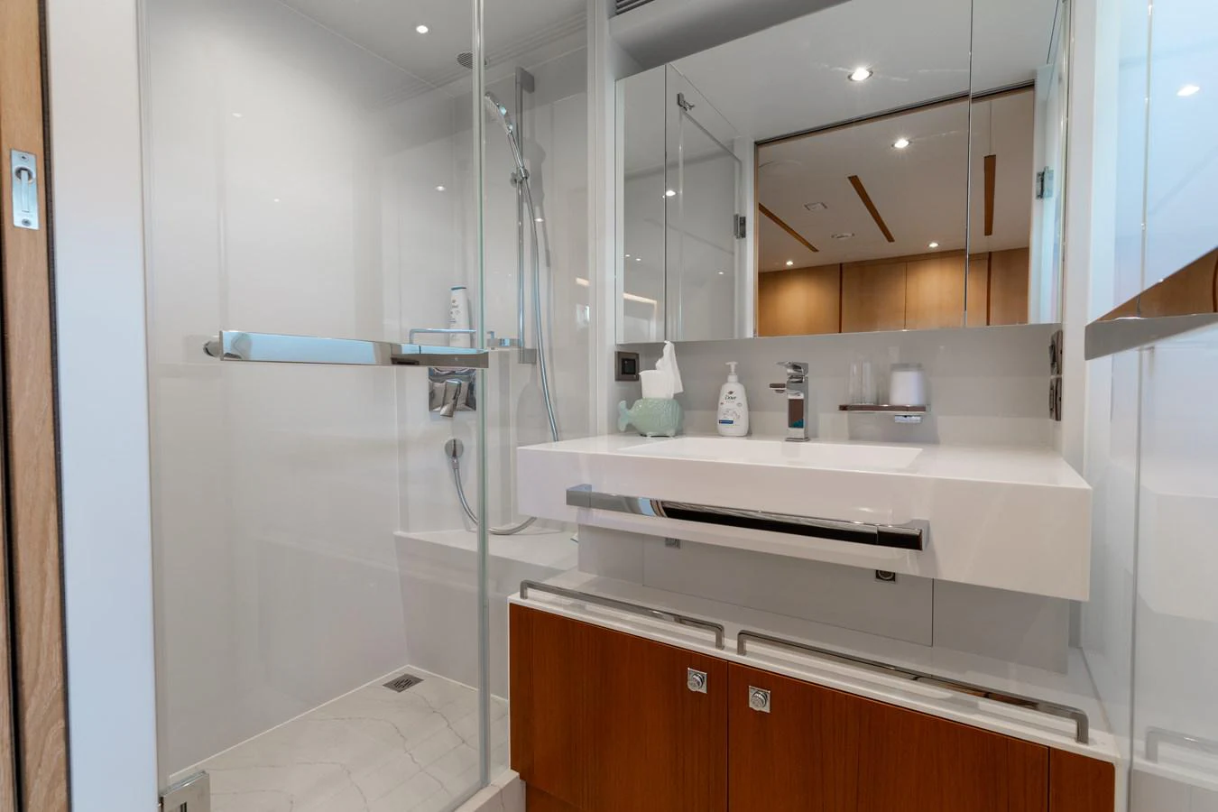 a bathroom with a glass shower aboard ONE MORE TIME Yacht for Sale