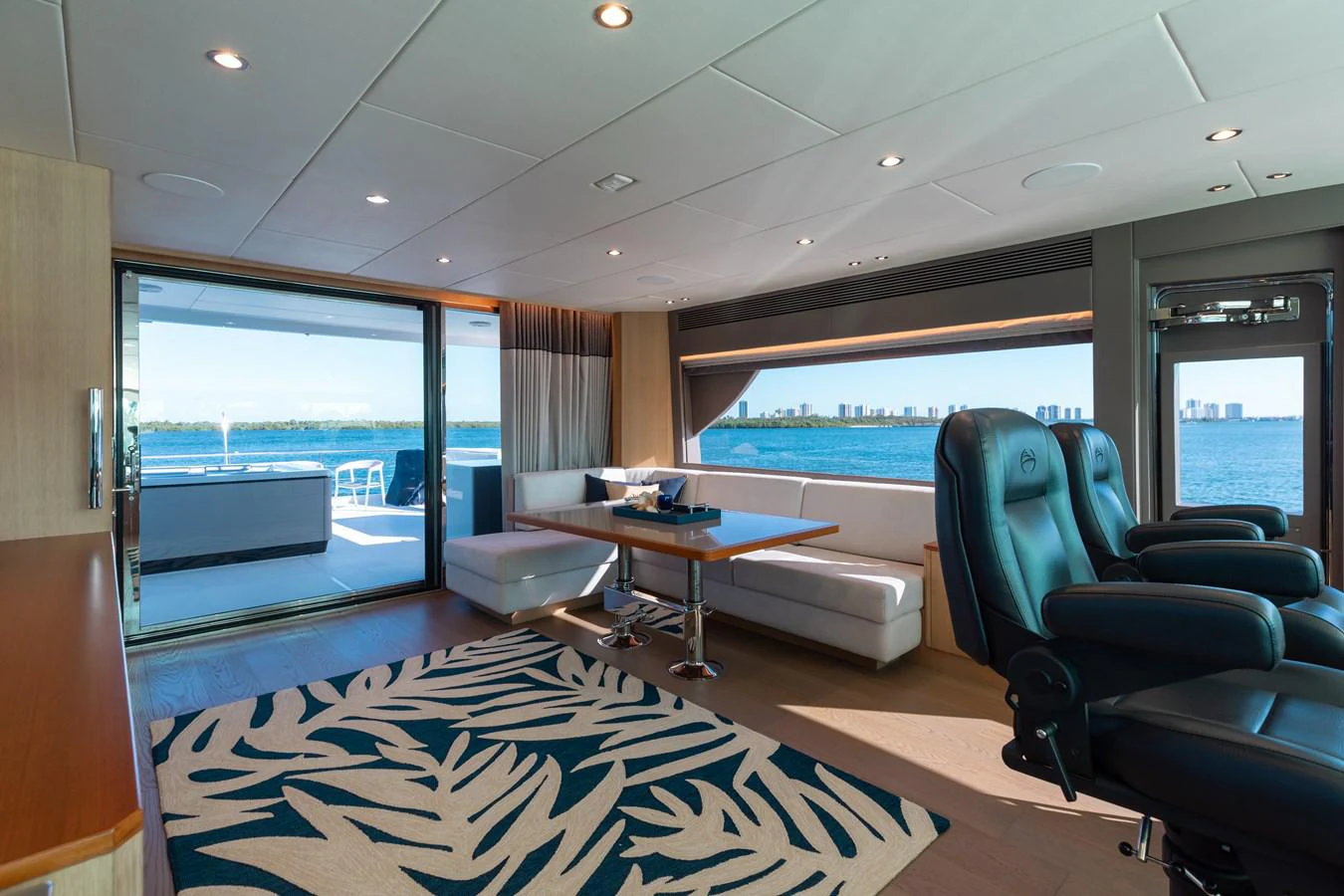 a room with a table and chairs aboard ONE MORE TIME Yacht for Sale