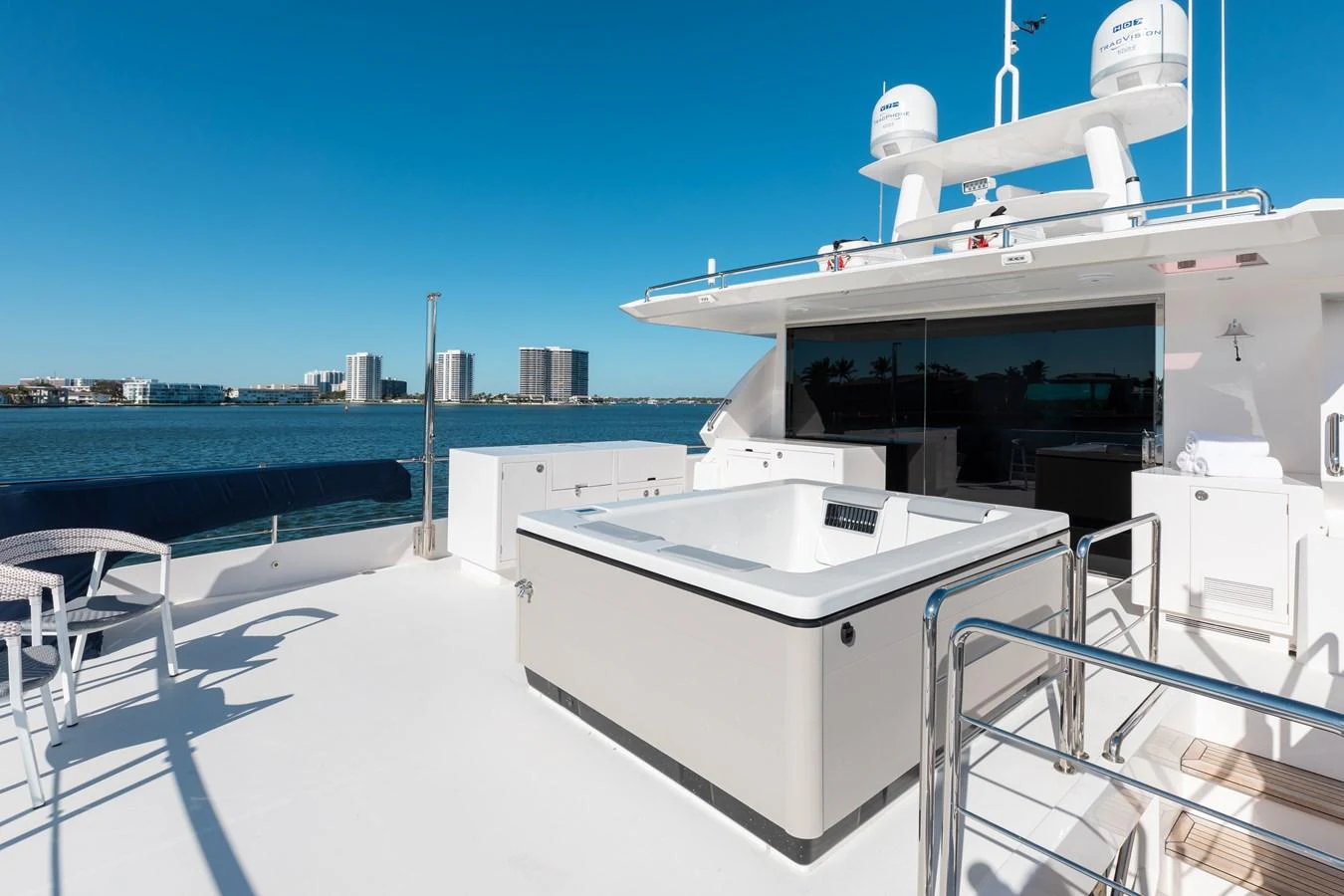 a white boat on a deck aboard ONE MORE TIME Yacht for Sale