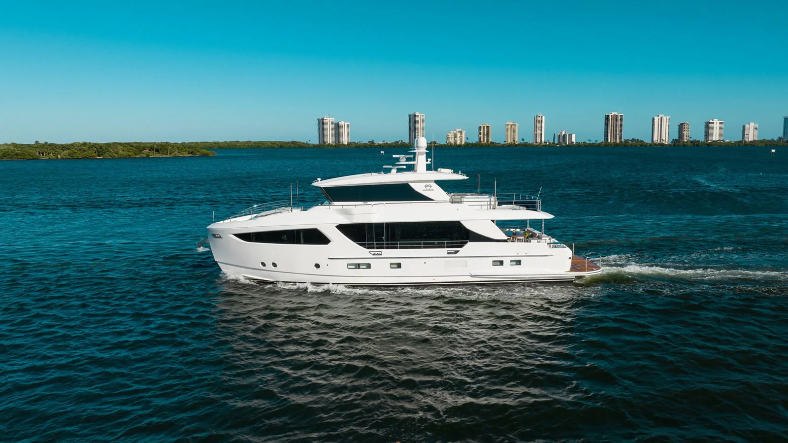 a white yacht on the water aboard ONE MORE TIME Yacht for Sale