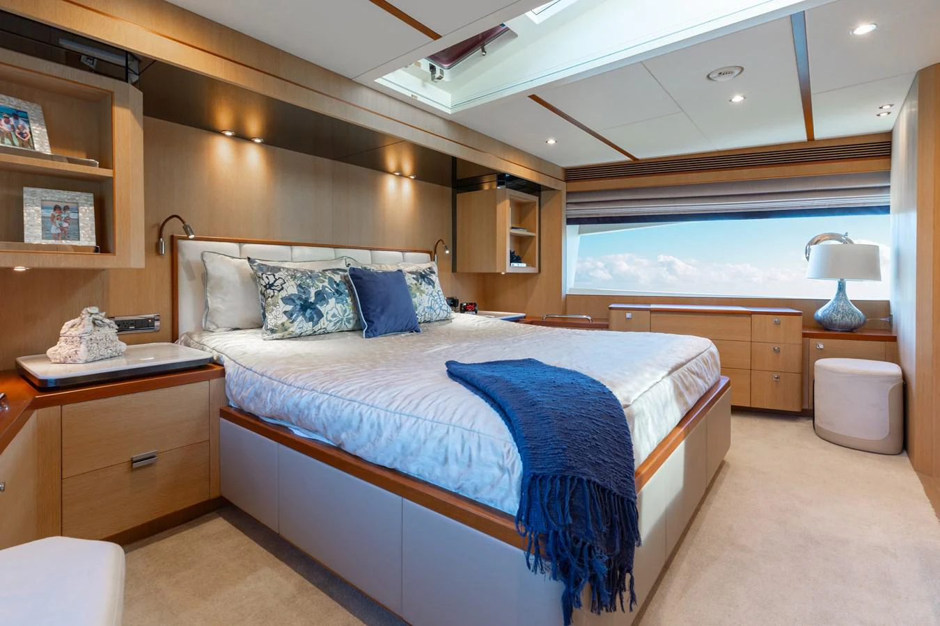 a bedroom with a bed and a desk aboard ONE MORE TIME Yacht for Sale