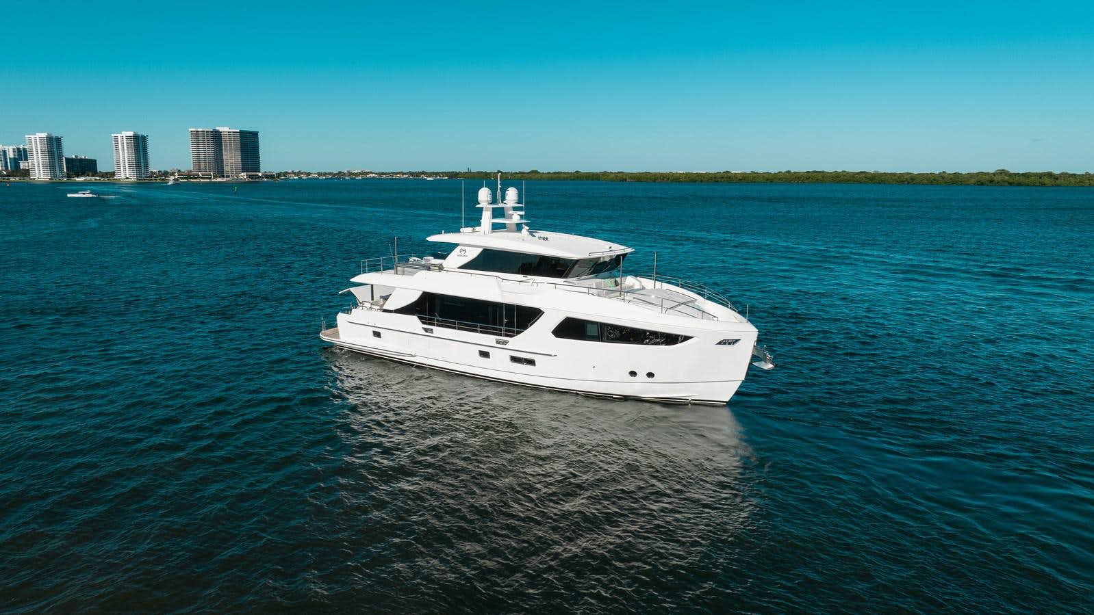 a white yacht in the water aboard ONE MORE TIME Yacht for Sale