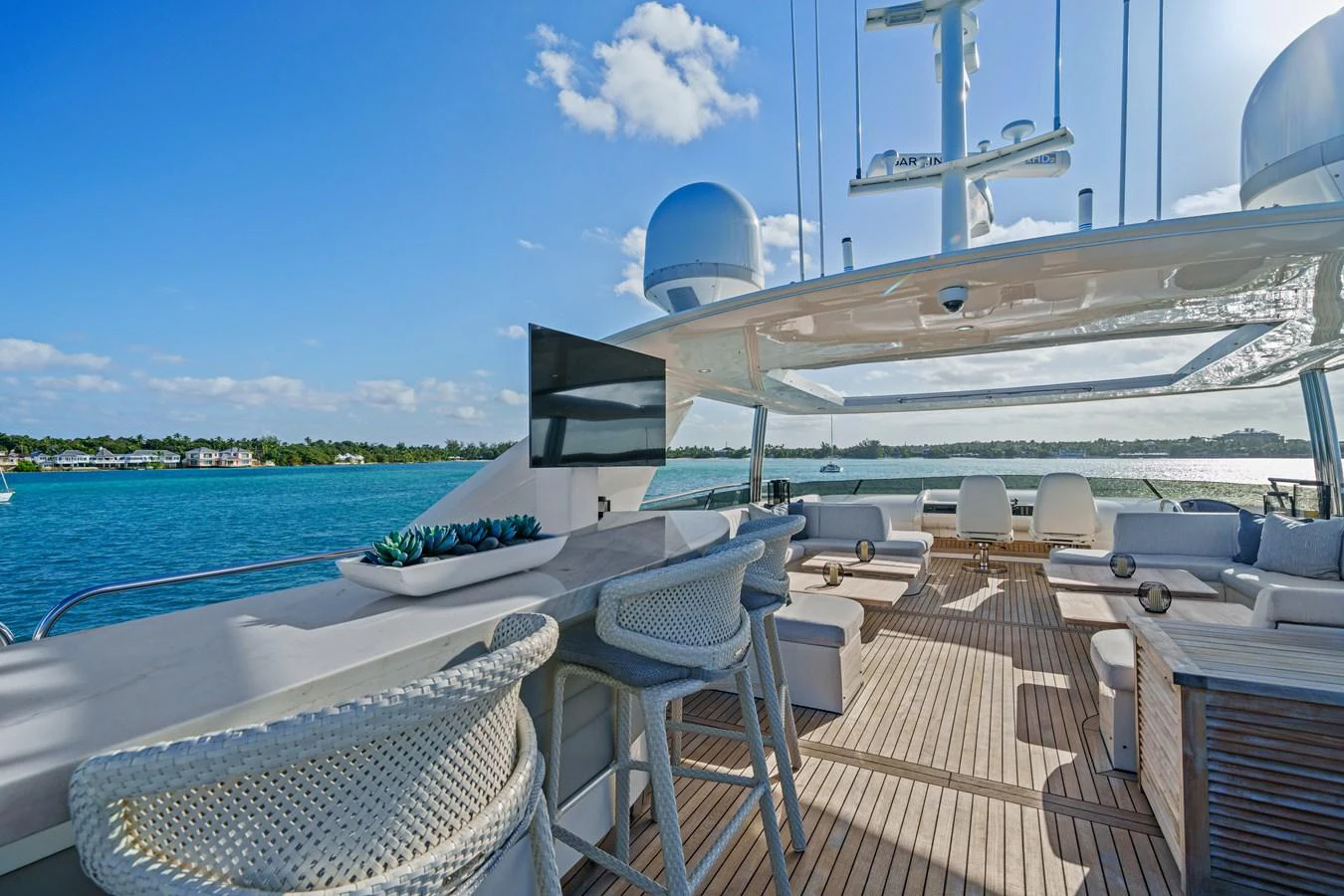 a deck with chairs and a large ship on it aboard CURRENT $EA Yacht for Sale